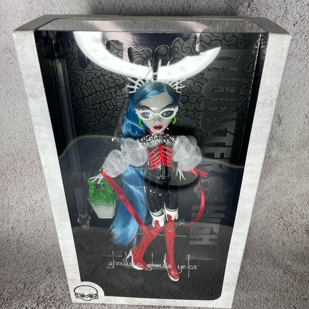monster high doll with blue hair, red and white outfit